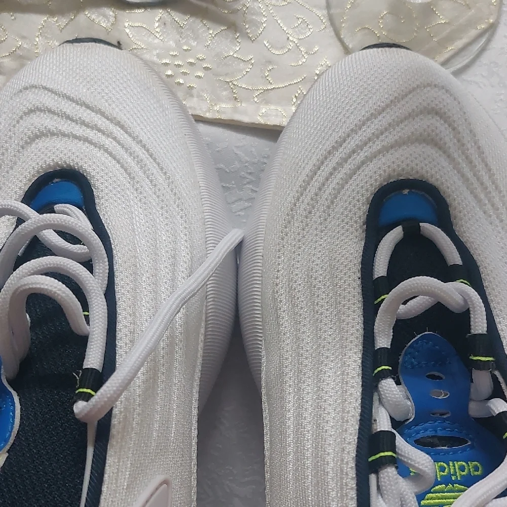 Adidas Adifom SLTN shoes in the Cloud White / SolarYellow / Blue Colorway